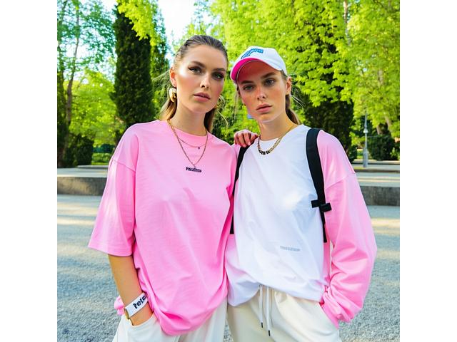 Bright outdoor editorial image of Summer 2022 casual streetwear with light fabrics and relaxed style